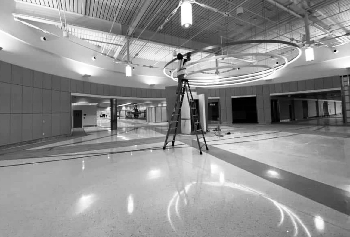 Third Coast Maintenance crew performing construction cleaning inside an airport terminal build