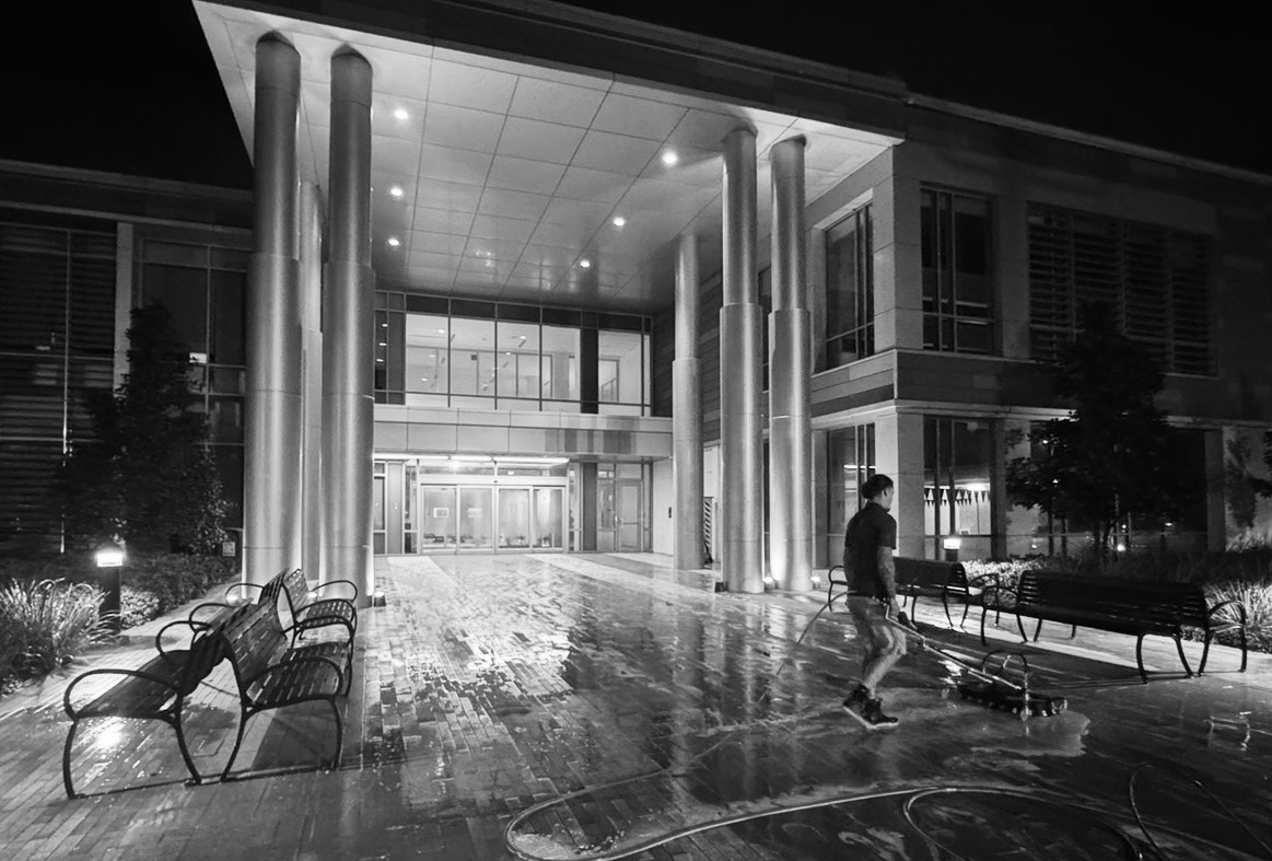 Third Coast Maintenance crew washing a large commercial building exterior