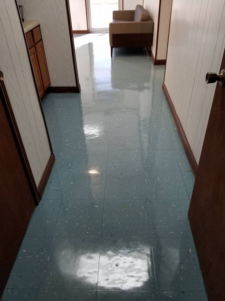 Corridor floor in Parks, LA after a full strip and wax by Third Coast Maintenance