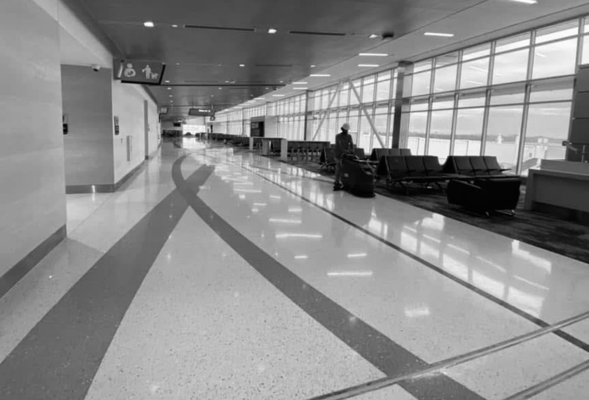 Third Coast Maintenance crew working inside a large commercial airport construction project
